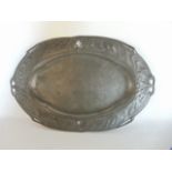 An Art Nouveau pewter dish, of oval form with floral detail and pierced decoration (unmarked)