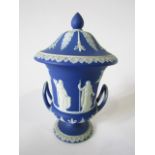 A 19th century Wedgwood blue ground jasperware two-handled urn-shaped vase and cover, with classical