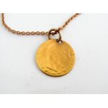 A French coin pendant, Napoleon III 5 Francs 1857, on a 9ct gold curb-link chain, 4.1g in total