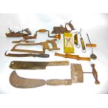 A selection of various antique tools to include saws, etc