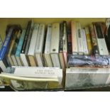 A box containing a collection of World War One related books including The Beauty & The Sorrow by