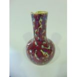 A collection of oriental ceramics comprising a vase of globular body and drawn neck and mottled