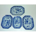 A graduated set of four 19th century oriental blue and white plates of rectangular form with painted