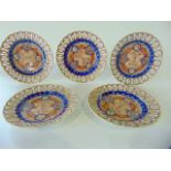 A set of five 19th century oriental dessert plates with painted Imari type detail and with pierced