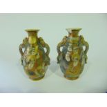 A pair of late 19th century Satsuma vases with painted and gilded male character detail and