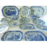 A collection of early 19th century and other oriental blue and white dinner wares, mostly with