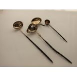 A miscellaneous collection of three Georgian silver toddy ladles, various makers and dates, each