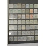 A stock book containing a quantity of early stamps from Spanish Colonies, Cuba, Chile, Colombia,