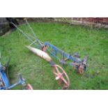 A Victorian cast iron single furrow horse drawn plough, 11 feet long approximately