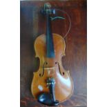 An old violin labelled to interior 'Copy of Stradivarius'