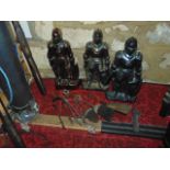 A trio of fireside companions, each in the form of standing cast iron knights, all with lustred