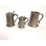 A one pint pewter tankard and two further lidded pewter pots (3)