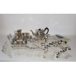 A good quality 19th century electro plated teapot with embossed foliate decoration together with a