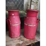 A pair of vintage cast iron two handled milk churns with raised lettering to band, Cadbury Bros Ltd,