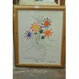 A coloured print after Picasso showing hands clasping a bunch of flowers, with printed signature and