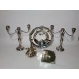 A pair of three divisional silver plated candelabrum each with fluted scrolling arms, together