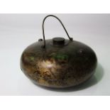 An old Japanese metal work flask/bottle of squat bulbous form with central screwing cap and