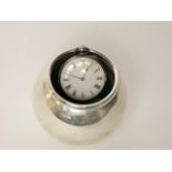 An Edwardian silver watch stand, indecipherable maker's mark, Birmingham, 1906, of plain orb form,