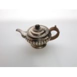 A William IV silver teapot, Charles Thomas Fox, London, 1831, the circular body with gadroon