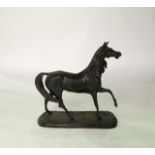 A cast metal study of a trotting horse, raised on a simple stepped rounded rectangular ground,