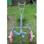 A Victorian cast iron single furrow horse-drawn plough, stamped "Ransomes Sims and Jeffries Ltd