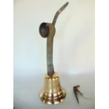 A good quality 19th century cast brass exterior door bell, on a coiled iron sprung frame, 56cm