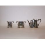 A 19th century A1 silver-plated teapot, two-handled sugar basin and milk jug, all with chased