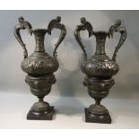 PAIR OF BRONZED SPELTER MANTEL URNS PATINATED WITH A BRONZE FINISH IN A CLASSICAL STYLE WITH