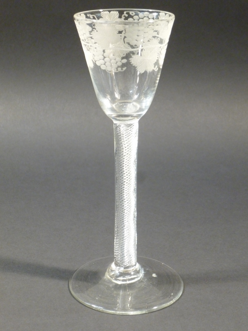 C18th (CIRCA 1760) ENGLISH MULTI SPIRAL AIR TWIST WINE GLASS, THE POINTED ROUND FUNNEL BOWL ENGRAVED