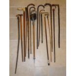 THREE SILVER MOUNTED WALKING STICKS, OTHER WALKING STICKS, THREE CANES AND A SHOOTING STICK [15]