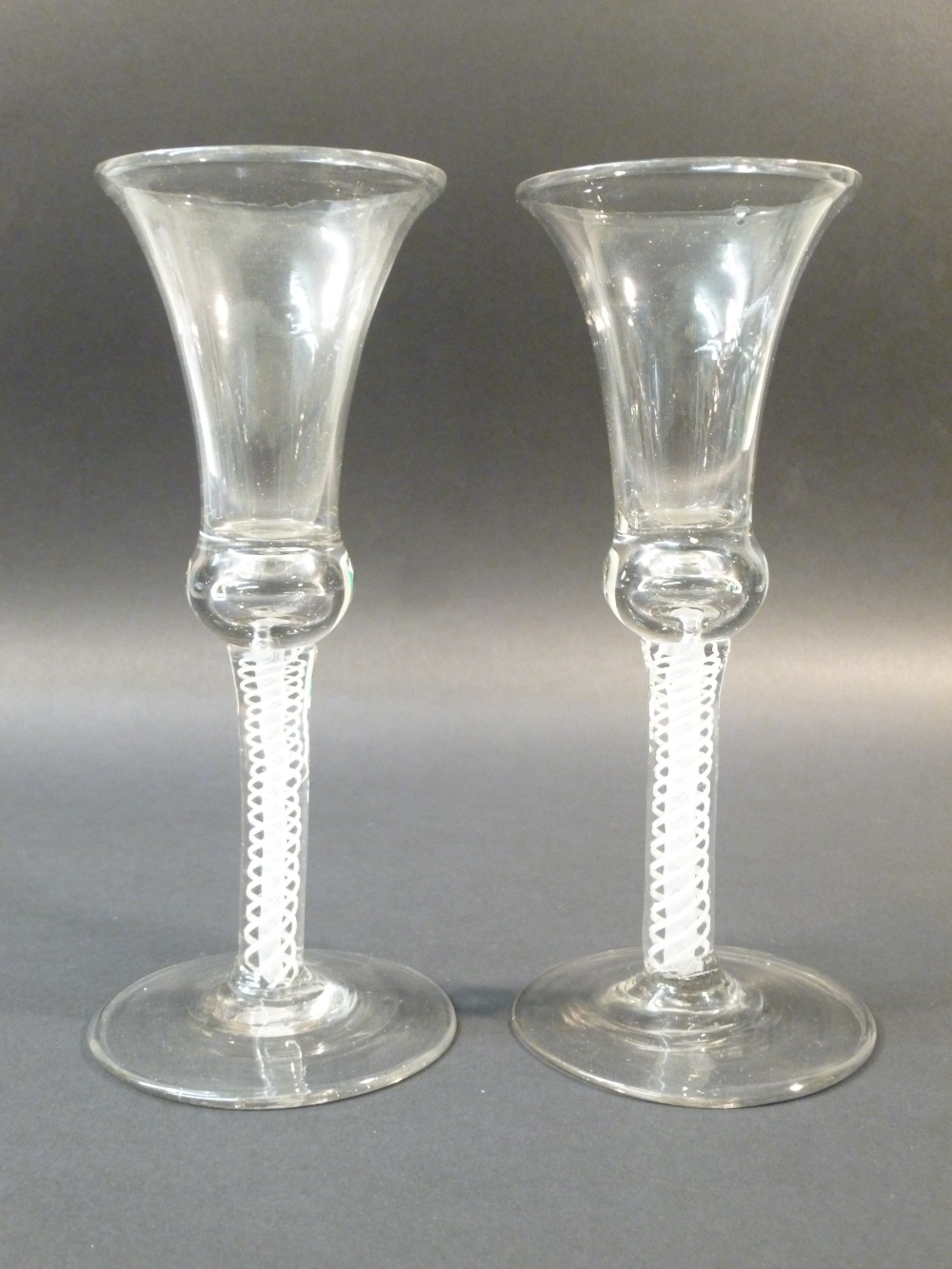 TWO 18TH CENTURY WINE GLASSES (NEAR PAIR) WAISTED BELL BOWL, SOLID BASE; DSOT- HEAVY SPIRAL TWIST