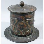 ARTS AND CRAFTS (POSSIBLY NEWLYN) HAMMERED AND RIVETED TOBACCO JAR ON CIRCULAR BASE, STYLISED FLORAL