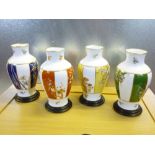 SET OF 4 JAPANESE PORCELAIN BALUSTER VASES EACH WITH FLORAL DECORATION, ON A STAND (H: 28 cm)