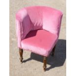 VICTORIAN CORNER ARMCHAIR UPHOLSTERED IN PINK DRALON, ON FAUX ROSEWOOD TURNED TAPERING LEGS (H: