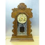 AMERICAN ANSONIA CLOCK COMPANY SHELF CLOCK WITH A CIRCULAR DIAL ENCLOSING AN 8 DAY STRIKING MOVEMENT