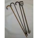 A SHOOTING STICK, TWO WALKING STICKS WITH SILVER KNOBS AND A ROSEWOOD STICK [4]