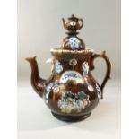 LARGE BARGEWARE TEAPOT WITH TEAPOT COVER INSCRIBED "A PRESENT TO A FRIEND", ON A FOLIATE GROUND (