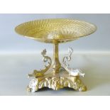 C19th ITALIAN BRASS TAZZA WITH A CIRCULAR BOWL ON A TRIANGULAR BASE MOUNTED WITH 3 DOLPHINS (H: 17.5