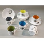 SIX SUSIE COOPER 'BLACK FRUIT' COLOURED CUPS (DIA: 6.5 cm) AND SAUCERS (DIA: 14 cm) [12]