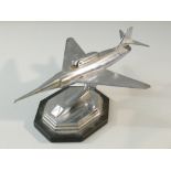 1950's NOVELTY CHROME TABLE LIGHTER IN THE FORM OF A JET FIGHTER, MOUNTED ON A BALL JOINT, THE