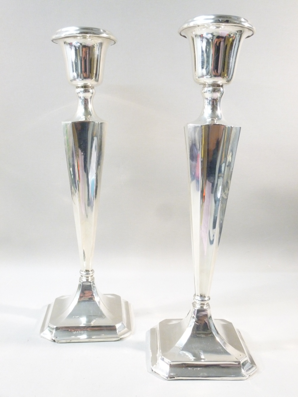 PAIR OF LARGE SILVER CANDLESTICKS ON A TAPERING STEM BY JAMES DEAKIN & SONS, CHESTER 1915, HEIGHT 31