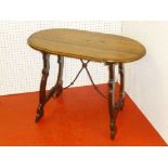 SPANISH WALNUT TABLE WITH AN OVAL TOP, ON WROUGHT IRON AND SHAPED END SUPPORTS (64 cm x 90 cm x 51.4