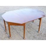 MAHOGANY OCTAGONAL DINING TABLE WITH A LEAF, ON TAPERING LEGS WITH CLUB FEET H.70.5cm W.169cm D.25cm