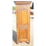 19th CENTURY FRENCH OAK CUPBOARD, A SINGLE ORNATELY CARVED DOOR ON THREE HINGES DISCLOSING
