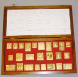 ROYAL STAMPS OF THE EMPIRE, A COLLECTION OF 25 SILVER-GILT REPLICA STAMPS FROM A LIMITED EDITION