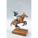 SATURNO STERLING SILVER AND ENAMEL POLO PLAYER AND PONY MOUNTED ON A MAHOGANY PLINTH (H: 14 cm)