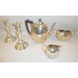 PAIR OF SILVER PLATED CANDLESTICKS, SILVER PLATED TEAPOT, SUGAR BOWL AND JUG ALL WITH 'S' ENGRAVED