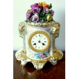 FRENCH MANTLE CLOCK WITH AN EIGHT DAY STRIKING MOVEMENT STRIKING ON A BELL, IN A PORCELAIN CASE WITH