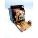 LATE C19th SANDERSON'S RED BELLOWS CAMERA WITH MAHOGANY AND BRASS FITTINGS INSIDE A BLACK