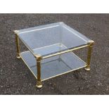 CONTEMPORARY SQUARE BRASS COFFEE TABLE WITH CHAMPFERED GLASS TOP AND UNDERTIER ON FOUR OCTAGONAL